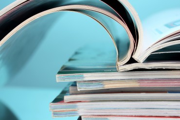 bigstock-stack-of-magazines-on-blue-bac-31793537.jpg