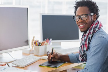 bigstock-Smiling-graphic-designer-using-47112646.jpg