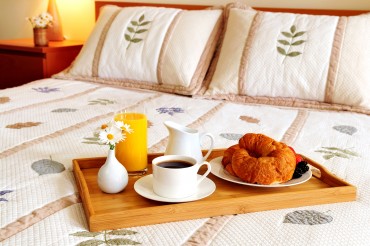 bigstock-Breakfast-On-Bed-In-A-Hotel-Ro-3068229.jpg
