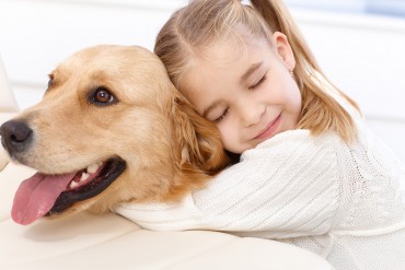 bigstock-Cute-little-girl-hugging-golde-38820214.jpg