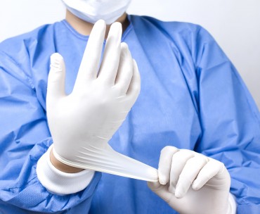 bigstock-doctor-putting-gloves-35504138.jpg
