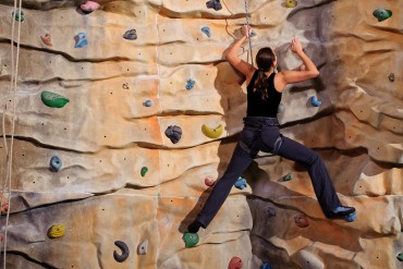bigstock-active-young-woman-on-rock-wal-18885752.jpg