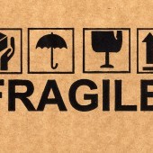bigstock-Fragile-Symbol-On-Cardboard-4293008.jpg