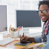 bigstock-Smiling-graphic-designer-using-47112646.jpg