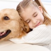 bigstock-Cute-little-girl-hugging-golde-38820214.jpg