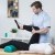 bigstock-Male-Physiotherapist-Exercisin-97075748.jpg
