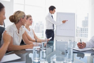 bigstock-Businessman-pointing-at-a-char-46875388.jpg