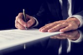 bigstock-Signing-Legal-Document-67353190.jpg