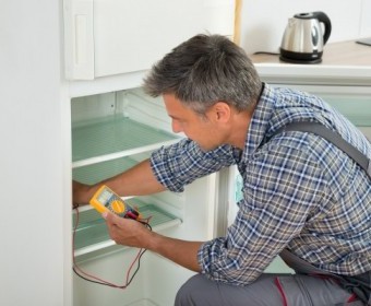 bigstock-Technician-Checking-Fridge-Wit-107243999.jpg