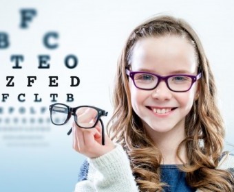 bigstock-Girl-Holding-Glasses-With-Test-85465427.jpg