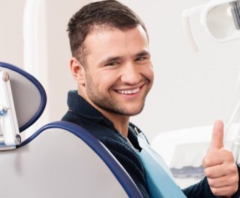 bigstock-Smiling-young-man-at-dentist-s-54454109.jpg