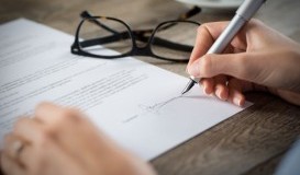 bigstock-Closeup-shot-of-a-woman-signin-104844545.jpg
