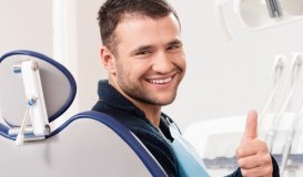 bigstock-Smiling-young-man-at-dentist-s-54454109.jpg