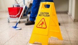 bigstock-Worker-Mopping-Floor-With-Wet--102667850.jpg