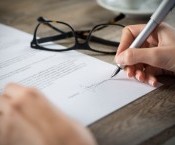 bigstock-Closeup-shot-of-a-woman-signin-104844545.jpg