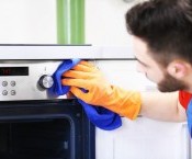 bigstock-Man-cleaning-oven-in-the-kitch-123683792.jpg
