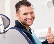 bigstock-Smiling-young-man-at-dentist-s-54454109.jpg
